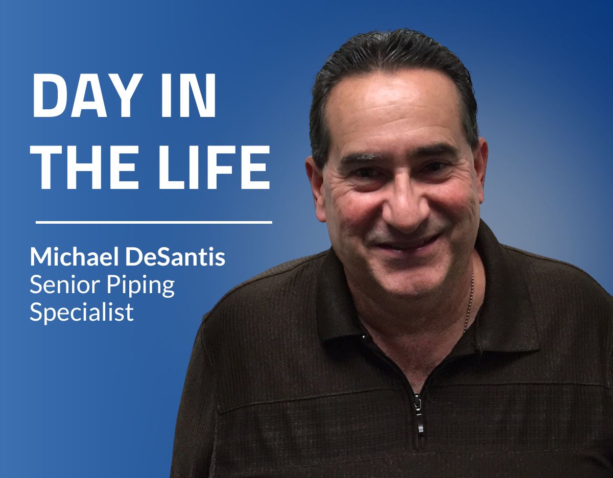 Portrait graphic of Michael DeSantis, Senior Piping Specialist, smiling and wearing a dark quarter-zip sweater against a blue background. The image includes the headline “Day in the Life” with his name and title displayed on the left.