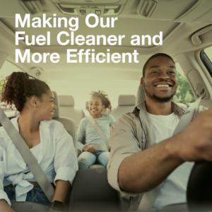 Smiling family driving in a fuel efficient vehicle