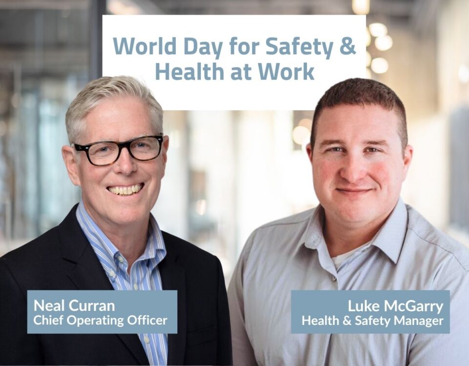 Promotional graphic for World Day for Safety & Health at Work featuring two Nexus leaders standing side by side in an office setting. Text on the image reads “World Day for Safety & Health at Work,” with name and title labels identifying Neal Curran, Chief Operating Officer, and Luke McGarry, Health & Safety Manager.