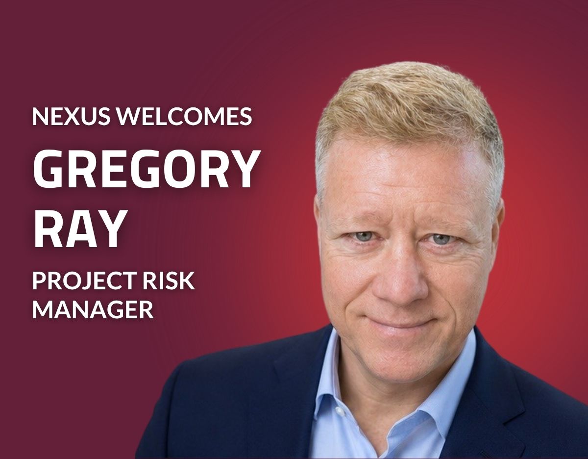 Promotional graphic with a red gradient background featuring a professional headshot of a person in a navy suit jacket and light blue dress shirt on the right side. Large white text on the left reads, "NEXUS WELCOMES GREGORY RAY" with the title "PROJECT RISK MANAGER" displayed below. The graphic announces Gregory Ray's addition to Nexus Engineering Group as Project Risk Manager.