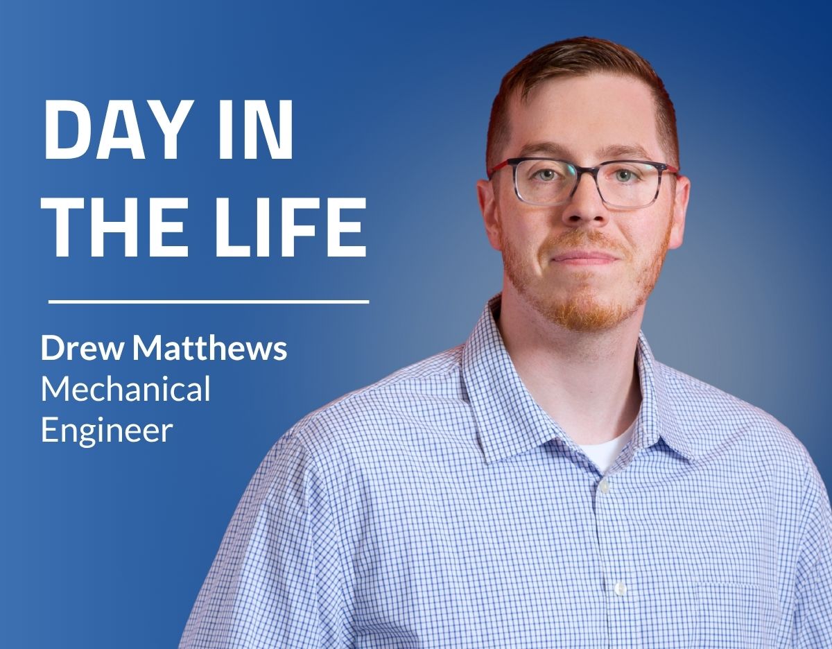 Promotional graphic featuring a professional headshot of an employee against a blue gradient background. Large white text on the left reads “DAY IN THE LIFE,” with smaller text below reading “Drew Matthews” and “Mechanical Engineer.” The right side of the image shows a person wearing glasses and a light blue checkered button-down shirt, facing the camera.
